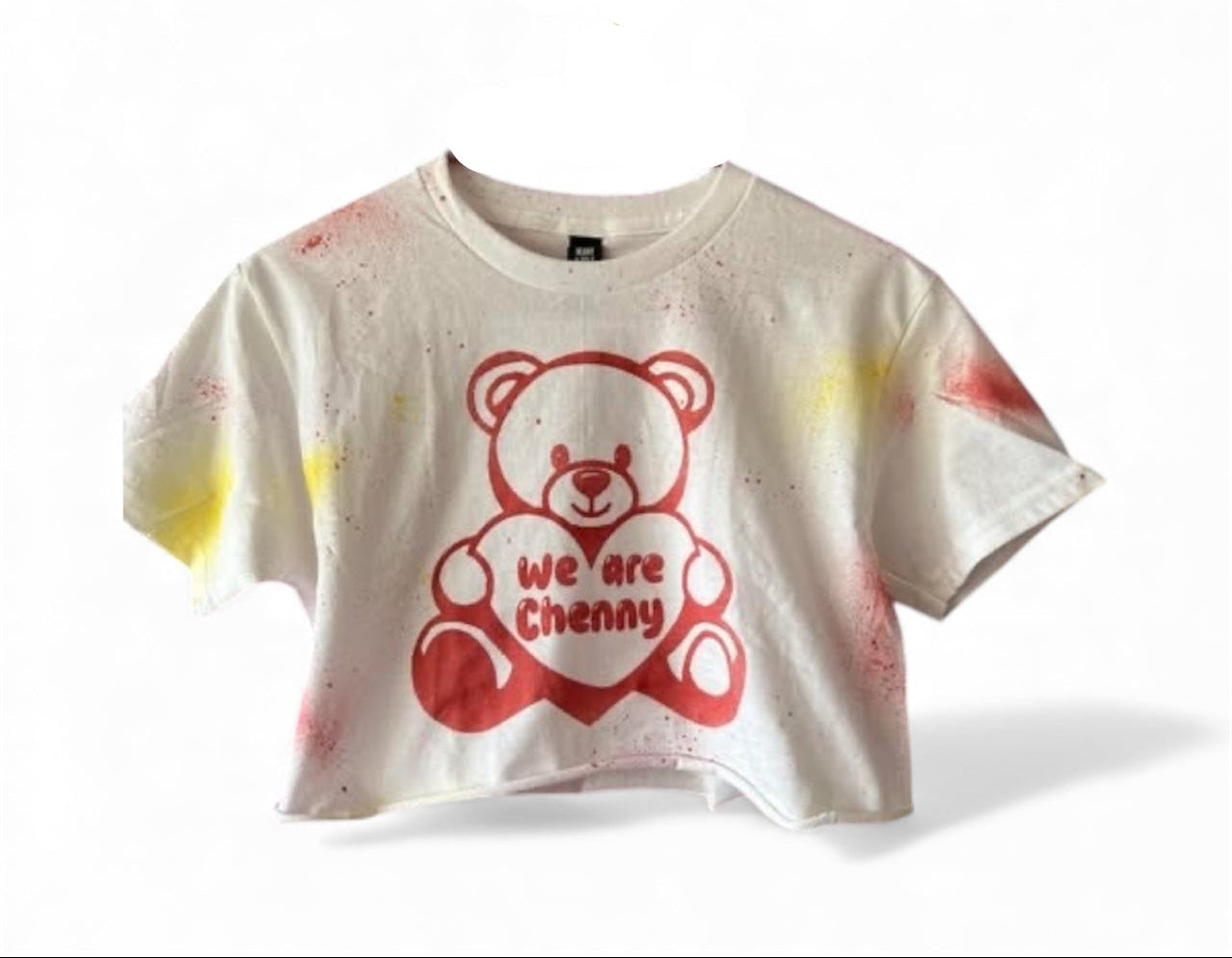White t-shirt with red teddy bear graphic and text on a white background